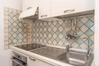 Kuchnia lub aneks kuchenny w obiekcie Sardegnaot vista mare piscina e spa