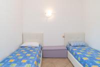 Łóżko lub łóżka w pokoju w obiekcie Sardegnaot vista mare piscina e spa