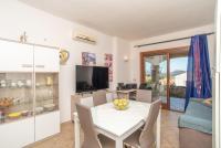 Telewizja i/lub zestaw kina domowego w obiekcie Sardegnaot vista mare piscina e spa