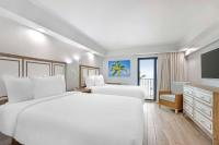 Ein Bett oder Betten in einem Zimmer der Unterkunft Best Western Plus Beach Resort