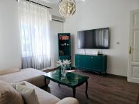 Televízia a/alebo spoločenská miestnosť v ubytovaní Apartment Zoey