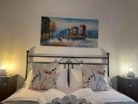Posteľ alebo postele v izbe v ubytovaní Casa Vacanze La Casa di Nonna Libia vicino Saturnia