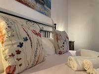 Posteľ alebo postele v izbe v ubytovaní Casa Vacanze La Casa di Nonna Libia vicino Saturnia