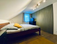Postel nebo postele na pokoji v ubytování Apartmány v ráji (Českém)