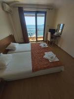 A bed or beds in a room at Guest House Skalite