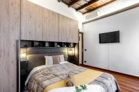 A bed or beds in a room at Trevi Fountain Luxury Guest House