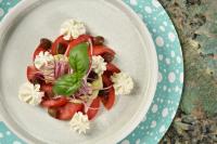 a plate of food with vegetables on a table at Grand Hotel Savoia in Genova