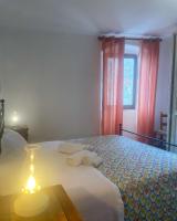 Posteľ alebo postele v izbe v ubytovaní Casa Vacanze La Casa di Nonna Libia vicino Saturnia