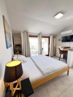 Łóżko lub łóżka w pokoju w obiekcie Rooms & Apartments Hegic