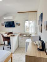 Kuchnia lub aneks kuchenny w obiekcie Rooms & Apartments Hegic