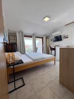 Łóżko lub łóżka w pokoju w obiekcie Rooms & Apartments Hegic