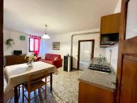 Televízia a/alebo spoločenská miestnosť v ubytovaní Casa Vacanze La Casa di Nonna Libia vicino Saturnia