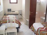 Posteľ alebo postele v izbe v ubytovaní Scano Comfort Inn