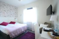 Postel nebo postele na pokoji v ubytování Nynäsgården Hotell & Konferens