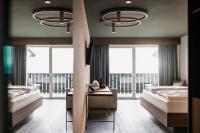A bed or beds in a room at Hotel Belvedere - Fine Dining, Hideaway & SPA