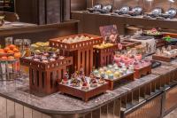 a buffet of desserts and pastries on a table at Orange Crystal Hotel Zhizhu Garden East China Normal University Minhang District Shanghai in Shanghai
