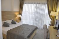 Postel nebo postele na pokoji v ubytování Ozyigit Otel