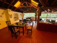 a dining room with tables and chairs in a restaurant at Andenes del Inca Hotel in Ollantaytambo