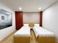 K&T Hotel Sân Bay TSN-150m từ Nhà Ga T3にあるベッド