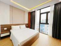 K&T Hotel Sân Bay TSN-150m từ Nhà Ga T3にあるベッド