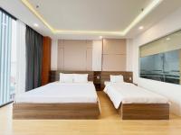 K&T Hotel Sân Bay TSN-150m từ Nhà Ga T3にあるベッド