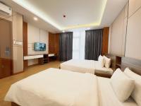 K&T Hotel Sân Bay TSN-150m từ Nhà Ga T3にあるベッド