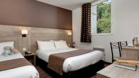 Hôtel Beau Siteにあるベッド