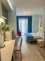 Łóżko lub łóżka w pokoju w obiekcie Hotel Négy Évszak