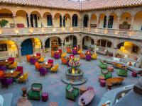 an overhead view of a courtyard with tables and chairs at Novotel Cusco in Cusco