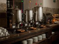 a kitchen with two large pots and pans on a counter at Novotel Cusco in Cusco