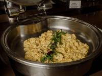a metal pot filled with food with herbs in it at Novotel Cusco in Cusco