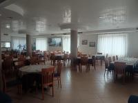 a dining room with tables and chairs in a building at Hotel Sirios in San Giovanni Rotondo