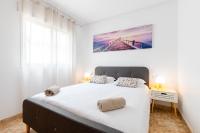 A bed or beds in a room at La Kaye