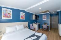 A bed or beds in a room at Taksim Trend Residence