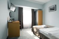 Hotel Poniatowskiにあるベッド