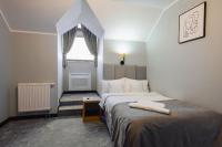 Hotel Poniatowskiにあるベッド