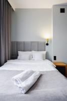 Hotel Poniatowskiにあるベッド