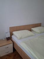 Posteľ alebo postele v izbe v ubytovaní Seaview Apartments Kampor 3708