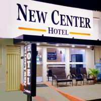 a new center hotel sign in front of a building at New Center Hotel in Carolina