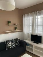 TV a/nebo společenská místnost v ubytování La Garita Bay Apartments