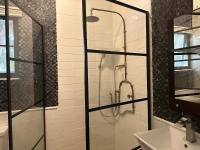 a bathroom with a shower with a glass door at Lower Price, More Style, Discount Studio In San Juan,Pr, Beach, Free Bikes in San Juan