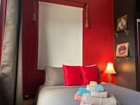 a bedroom with a bed with towels on it at Lower Price, More Style, Discount Studio In San Juan,Pr, Beach, Free Bikes in San Juan