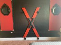 a x sign on a wall with orange doors at Lower Price, More Style, Discount Studio In San Juan,Pr, Beach, Free Bikes in San Juan