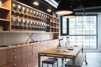 a tasting room with a table and cabinets and a window at Art&#39;otel Ximending Taipei in Taipei