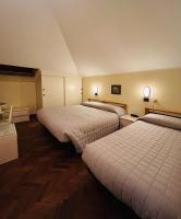 A bed or beds in a room at Hotel Milano