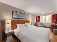 Postel nebo postele na pokoji v ubytování Radisson Blu Hotel Olümpia