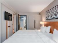 Postel nebo postele na pokoji v ubytování Radisson Blu Hotel Olümpia