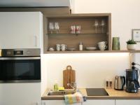 SEE & THE CITY apartmentsにあるキッチンまたは簡易キッチン