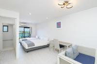 Hotel & Villa Seahorse MIYAKOJIMAにあるベッド