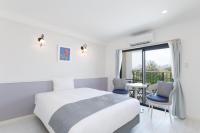 Hotel & Villa Seahorse MIYAKOJIMAにあるベッド